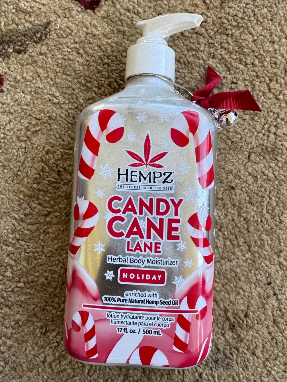 Hempz Candy Cane Lane Herbal Body Moisturizer in a 17 fl. oz. pump bottle